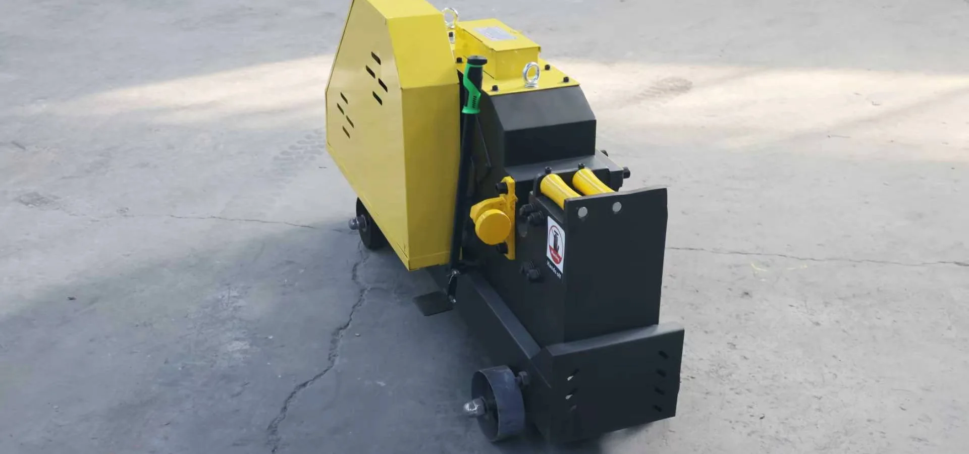 Electric rebar cutting machine on a concrete slab